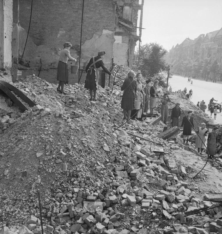 People clearing rubble among ruined buildings in Germany in 1945